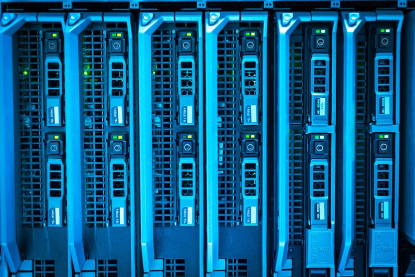 Rows of high-performance server racks in a green-lit data center, highlighting massive data storage infrastructure, professional photography